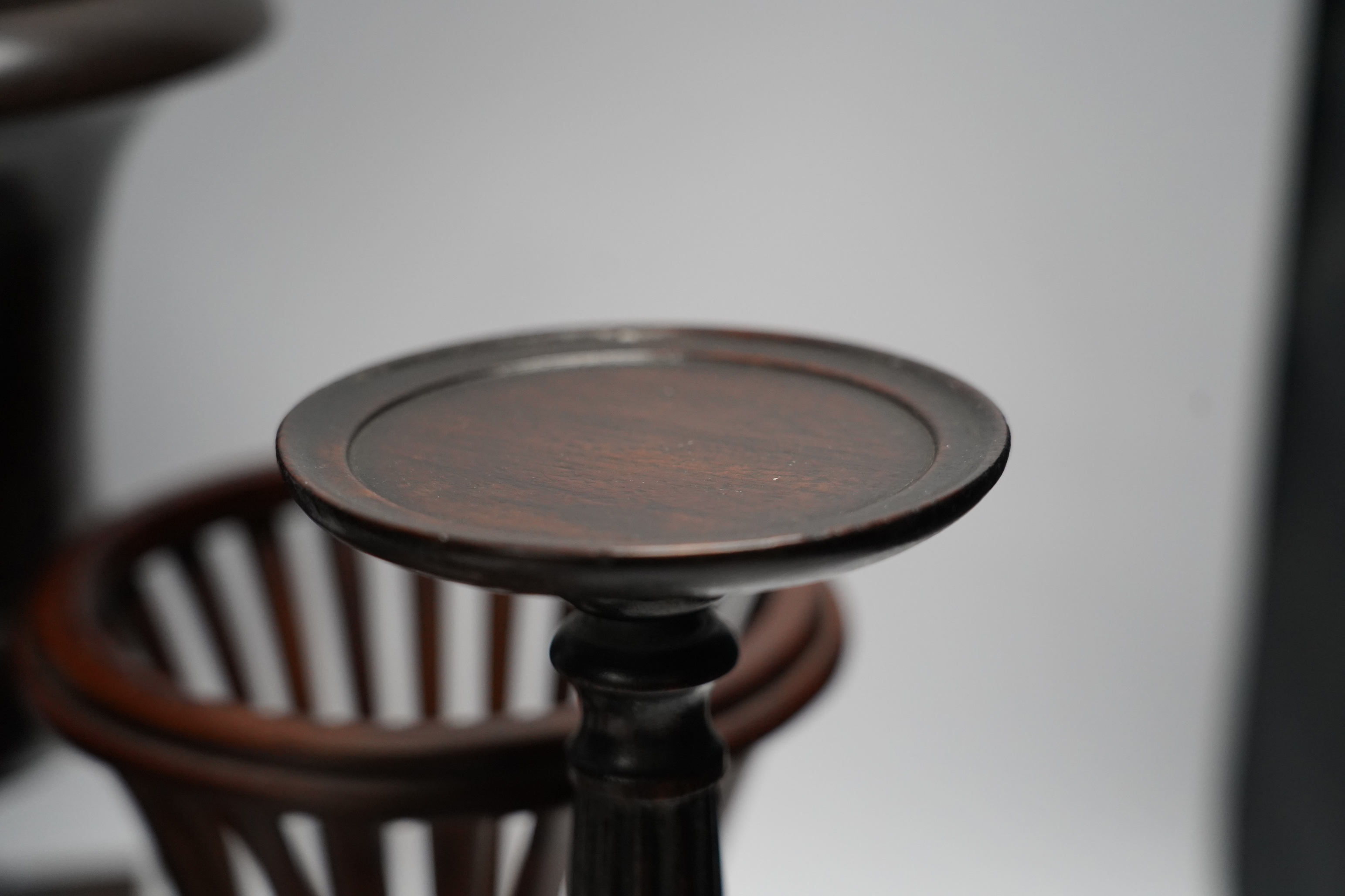 A mixed group of decorative treen effects, tall vases, candle stands etc, tallest 36cm
